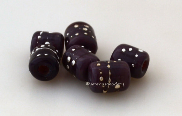 Tiny Tube Eggplant Fine Silver Dots deep purple tube-shaped lampwork glass beads decorated with fine silver dotsThe last picture shows these in my hand for size reference. They are tiny tiny tiny!!~~~~~~~~~~~~~~~~~~~~~~~~~~6x6 mm6 Beads1.5 mm hole Default Title