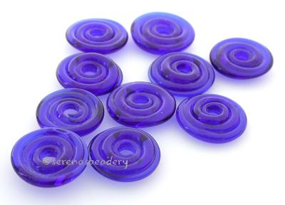 Transparent Cobalt Wavy Disk Spacer  10 wavy disks in transparent cobalt2 sizes available: 11-12 mm with 1.5 mm hole or 13-14 mm with 2.5 mm holeprice is per 10 disks 11-12 mm 1.5 mm hole,12-13 mm 2.5 mm hole