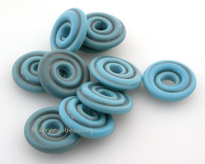 Dark Turquoise Tumbled Wavy Disk Spacer 10 tumbled wavy disks in dark turquoise2 sizes available: 11-12 mm with 1.5 mm hole or 13-14 mm with 2.5 mm holeprice is per 10 disks 11-12 mm 1.5 mm hole,12-13 mm 2.5 mm hole