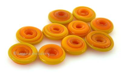 Yellow Ocher Wavy Disk Spacer 10 wavy disks in yellow ocher2 sizes available: 11-12 mm with 1.5 mm hole or 13-14 mm with 2.5 mm holeprice is per 10 disks 11-12 mm 1.5 mm hole,12-13 mm 2.5 mm hole