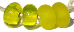 Electric Yellow Color Notes: bright yellow, sometimes cloudy 5x10 mm Available shapes and sizes:Round Bead Shapes: Available to order 8 to 15 mm with hole sizes ranging from 1.5 to 5 mm. See drop down menu for the exact options. Shown here in 8, 9 and 10 mm with both a 2.5 mm and 1.5 mm hole. 4 and 5 mm holes will fit European Charm style jewelry.Also available in a wavy disk or bead cap:. Pressed bead shapes:Lentil - 12x13 mm in size with a 1.5mm hole.: Pillow 13 mm square with a 1.5 mm hole.: Tab: Default