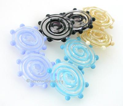 Ribbon Wavy Disks with Dots Ribbon disks with matching dots - shown here in dark turquoise, periwinkle, black, and ivory.3x17-18 mmprice is per 6 disks Default Title