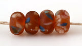 Hot August Night Matte 7x11 mm4 BeadsHole Size: 2.5 mm~ A set of transparent amber beads decorated with peach, cream and blue in a matte finish. ~ This lampwork glass bead set is ready to ship. Default Title