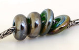 Four 7x14 and 3x15 mm4 BeadsHole Size: 5 mm~ Dark green silver luster with brown highlights in donut and disc shapes. ~ This lampwork bead set is ready to ship. Default Title