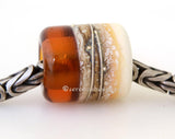 Amber Beach European Charm One European charm style bracelet bead with ivory, silvered ivory, fine silver. Bead Size: 13x11 mm Amount: 1 Bead Hole Size: 5 mm Glossy,Matte