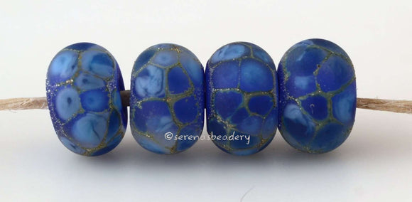 Blue Galaxy #2017 8x12-13 mm4 BeadsHole Size: 2.5 mm~ Luscious blue cased in more blue and fine silver in a matte finish. ~ This lampwork glass bead set is ready to ship. Default Title