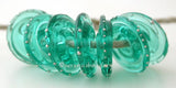 Light Teal Fine Silver Disc Transparent light teal wrapped in fine silver. 3x14mm Price is per bead. Glossy,Matte