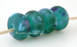 Duck Day Teal green lampwork glass beads with green, turquoise and purple frit.Bead Size: 6x11-12 or 7x13-14 mmHole Size: 2.5 mmprice is for one bead with a discount for 4 or more 11-12 mm,Glossy,13-14 mm,Glossy,11-12 mm,Matte,13-14 mm,Matte
