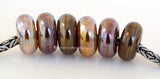 Honor #2038 7x14 mm3 BeadsHole Size: 5 mm2 Sets available. Both sets show together in the last photo.~ Gold, pink gold, and bronze luster metallic donut-shaped beads. ~ This lampwork glass bead set is ready to ship. Default Title