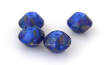 Blissful Bicones #2048 Size: 11x15 mm ~ Amount: 4 Beads ~ Hole Size: 2.5 mm ~ Four matching light blue encased bicones in olive, pink, yellow, and more blue. ~   These beads are ready to ship. Default Title