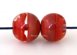 Red Ribbon Duo Globe Pair 11x12 mm2 BeadsHole Size: 1.5 mm~ A pair of super round globe-shaped beads in red and red ribbon. ~ These lampwork glass beads are ready to ship. Default Title