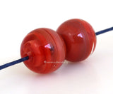 Red Ribbon Duo Globe Pair 11x12 mm2 BeadsHole Size: 1.5 mm~ A pair of super round globe-shaped beads in red and red ribbon. ~ These lampwork glass beads are ready to ship. Default Title