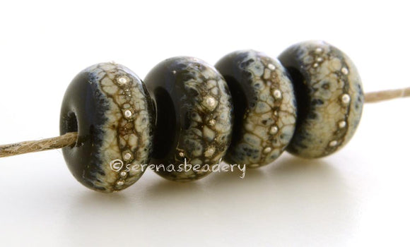 Black Granite with Fine Silver Black wrapped in silvered ivory and fine silver droplets. 5x11 mm 2.5 mm hole Price is per bead with discounts for larger quantities. Glossy,Matte