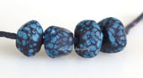 Tiny Black Turquoise Nuggets 6x9 mm4 BeadsHole Size: 1.5 mm~ Hand shaped nuggets in matte black splattered with turquoise blue. ~ These lampwork glass beads are ready to ship.   Default Title