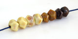 Steampunk Brown Nuggets #2073 6x9 mm8 BeadsHole Size: 1.5 mm~ Teeny tiny little hand-shaped nuggets ranging from pale yellow to metallic brown. ~ These lampwork glass beads are ready to ship. Default Title