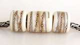 Ivory Silver Wraps Euro Charms Size: 10x12 &amp; 15x12 mm Amount: 3 Beads Hole Size: 5 mm Three dark ivory glossy tube beads decorated with fine silver.  Default Title