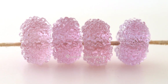 Pink Sugar Transparent pink lampwork glass beads with crystal clear sugar.Bead Size: 6x12 mmHole Size: 2.5 mmprice is for one bead with a discount for 4 or more Default Title
