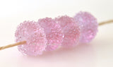 Pink Sugar Transparent pink lampwork glass beads with crystal clear sugar.Bead Size: 6x12 mmHole Size: 2.5 mmprice is for one bead with a discount for 4 or more Default Title