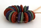 Wine Harvest Wavy Discs #2103 Purple, green and red spiral wavy disks3x14 mm18 BeadsHole Size: 2.5 mm These lampwork glass beads are ready to ship. Default Title