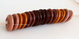 Fall Folly Wavy Discs #2104 Ginger, burnt orange, and 2 shades of brown spiral wavy disks3x14 mm16 BeadsHole Size: 2.5 mm These lampwork glass beads are ready to ship. Default Title