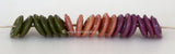 On the Spot Wavy Discs #2105 Green, peach, and purple spiral wavy disks3x14 mm18 BeadsHole Size: 2.5 mm These lampwork glass beads are ready to ship. Default Title