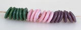 Make It Up #2107 Green, pink, and mauve spiral wavy disks3x14 mm18 BeadsHole Size: 2.5 mm These lampwork glass beads are ready to ship. Default Title