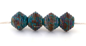Teal Raku Bicones A pair of ribbed bicones in teal green and raku.~~~~~~~~~~~~~~~~~~~~~~~~~~8x13 mm4 Beads2.5 mm hole These beads are ready to ship. Default Title