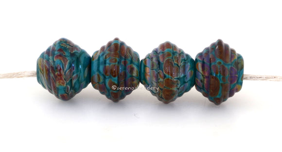 Teal Raku Bicones A pair of ribbed bicones in teal green and raku.~~~~~~~~~~~~~~~~~~~~~~~~~~8x13 mm4 Beads2.5 mm hole These beads are ready to ship. Default Title