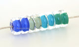 Its Raining #2119 Disc-shaped cased discs in pairs. Blue, mint, turquoise and green12-13 mm1.5 mm hole This lampwork beads set is ready to ship. Default Title