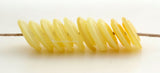 Misty Yellow Wavy Discs #2123 10 misty yellow wavy discs.13-14 mm2.5 mm hole These lampwork disc beads are ready to ship. Default Title