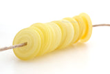 Misty Yellow Wavy Discs #2123 10 misty yellow wavy discs.13-14 mm2.5 mm hole These lampwork disc beads are ready to ship. Default Title