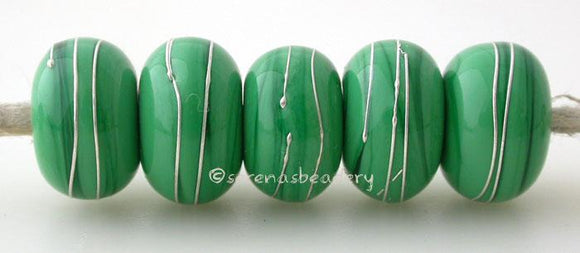 Dark Green with Silver Wraps dark green wrapped with fine silver wire lampwork glass beads~~~~~~~~~~~~~~~~~~~~~~~~~~6x11, 12 or 7x13 mm5 Beads2.5 mm hole Glossy,11 mm,Glossy,12 mm,Glossy,13 mm,Matte,11 mm,Matte,12 mm,Matte,13 mm