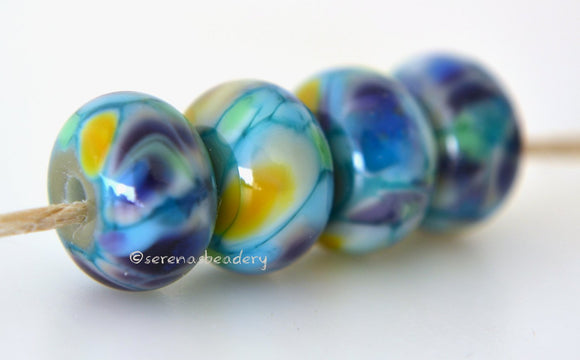 Cake Pop Turquoise blue lampwork glass beads with deep purple, green, golden yellow, blue, and amethyst..Bead Size: 6x11-12 or 7x13-14 mmHole Size: 2.5 mmprice is for one bead with a discount for 4 or more 11-12 mm,Glossy,13-14 mm,Glossy,11-12 mm,Matte,13-14 mm,Matte