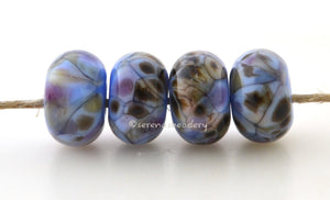 Whistle Dixie Light blue lampwork glass beads with dark brown, cream, and purple.Bead Size: 6x11-12 or 7x13-14 mmHole Size: 2.5 mmprice is for one bead with a discount for 4 or more 11-12 mm,Glossy,13-14 mm,Glossy,11-12 mm,Matte,13-14 mm,Matte