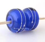 Dark Blue Thunder A layer of blue thunder over dark blue with a silver wrap.   6x12 mm with a 2.5 mm hole. Price is per bead. Glossy,Matte