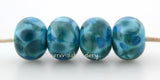 Iceberg Blue Turquoise blue lampwork glass beads with steel blue and aqua frit.Bead Size: 6x11-12 or 7x13-14 mmHole Size: 2.5 mmprice is for one bead with a discount for 4 or more 11-12 mm,Glossy,13-14 mm,Glossy,11-12 mm,Matte,13-14 mm,Matte