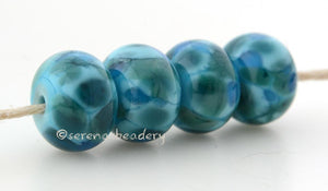 Iceberg Blue Turquoise blue lampwork glass beads with steel blue and aqua frit.Bead Size: 6x11-12 or 7x13-14 mmHole Size: 2.5 mmprice is for one bead with a discount for 4 or more 11-12 mm,Glossy,13-14 mm,Glossy,11-12 mm,Matte,13-14 mm,Matte