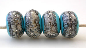 Turquoise Granite with Fine Silver Turquoise blue wrapped in silvered ivory and fine silver droplets. 5x11 mm 2.5 mm hole Price is per bead with discounts for larger quantities. Glossy,Matte