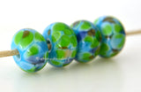Tortuga Bay Turquoise blue lampwork glass beads with lime green, brown, and blue.Bead Size: 6x11-12 or 7x13-14 mmHole Size: 2.5 mmprice is for one bead with a discount for 4 or more 11-12 mm,Glossy,13-14 mm,Glossy,11-12 mm,Matte,13-14 mm,Matte