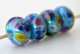 Funfetti Turquoise blue lampwork glass beads with blue, green pink, rose and bright green.Bead Size: 6x11-12 or 7x13-14 mmHole Size: 2.5 mmprice is for one bead with a discount for 4 or more 11-12 mm,Glossy,13-14 mm,Glossy,11-12 mm,Matte,13-14 mm,Matte
