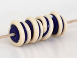 Cobalt Blue Cream Raised Spiral dark cobalt blue beads with a raised cream spiral 6x12 mm price is per bead Default Title