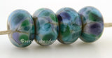 Potpourri Grey lampwork glass beads with purple, green, and steel blue frit.Bead Size: 6x11-12 or 7x13-14 mmHole Size: 2.5 mmprice is for one bead with a discount for 4 or more 11-12 mm,Glossy,13-14 mm,Glossy,11-12 mm,Matte,13-14 mm,Matte