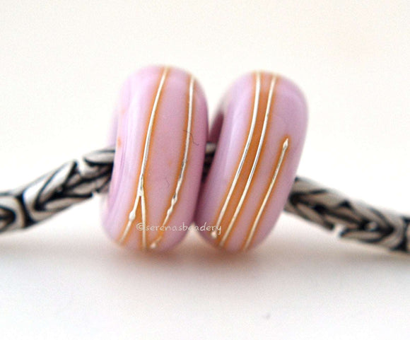 Bubble Gum Pink Fine Silver Wrap European Charm Bead one bubble gum pink handmade lampwork glass European charm spacer bead with a fine silver wrap6x14 mm with a 5mm holeprice is per bead Glossy,Matte
