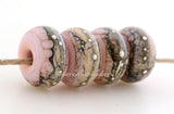 Bubble Gum Pink Granite with Fine Silver Bubble gum pink wrapped in silvered ivory and fine silver droplets. 5x11 mm 2.5 mm hole Price is per bead with discounts for larger quantities. Glossy,Matte
