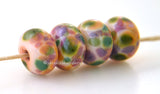 Whisper Soft Soft yellow lampwork glass beads with green, lilac, pink, plum, mauve and peach.Bead Size: 6x11-12 or 7x13-14 mmHole Size: 2.5 mmprice is for one bead with a discount for 4 or more 11-12 mm,Glossy,13-14 mm,Glossy,11-12 mm,Matte,13-14 mm,Matte