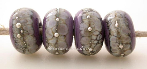New Violet Granite with Fine Silver New Violet wrapped in silvered ivory and fine silver droplets. 5x11 mm 2.5 mm hole Price is per bead with discounts for larger quantities. Glossy,Matte