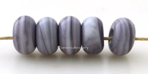 Lilac Dark Spacers #1964 5 Lilac Dark spacers, blend of lilac and white - 5x10 mm with a 2.5 mm hole, glossy finish. This handmade bead set is ready to ship! Default Title