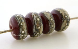 Deep Red Granite with Fine Silver Deep red wrapped in silvered ivory and fine silver droplets. 5x11 mm 2.5 mm hole Price is per bead with discounts for larger quantities. Glossy,Matte