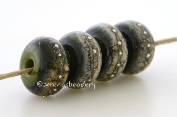 Green Cave Granite with Fine Silver Deep green wrapped in silvered ivory and fine silver droplets. 5x11 mm 2.5 mm hole Price is per bead with discounts for larger quantities. Glossy,Matte