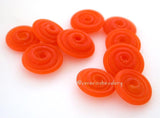 Tangerine Sparkle Matte Wavy Disk Spacer 10 wavy disks in tangerine sparkle, an odd lot glass with glitter2 sizes available: 11-12 mm with 1.5 mm hole or 13-14 mm with 2.5 mm holeprice is per 10 disks 11-12 mm 1.5 mm hole,12-13 mm 2.5 mm hole